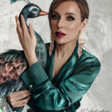 The portrait of girl with a peacock